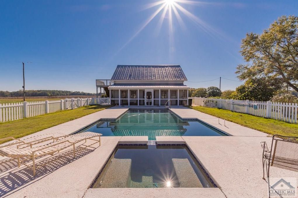 Pool and pool house in Newborn, GA farmhouse.