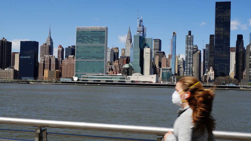 Manhattan apartment building and runner with mask