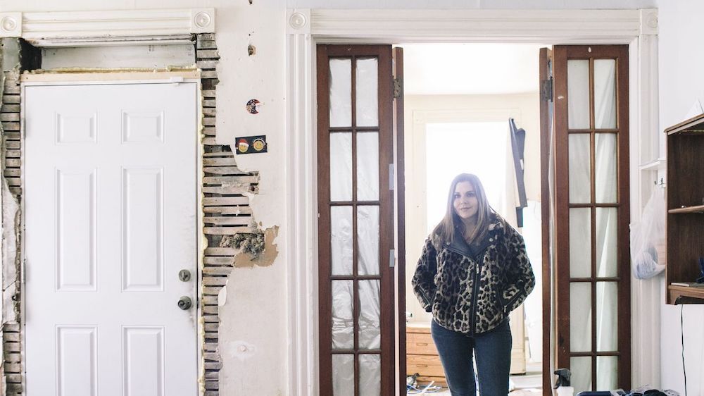 Kelly Stumphauzer in a home she bought to renovate and sell to an investor as a rental property in Cleveland.