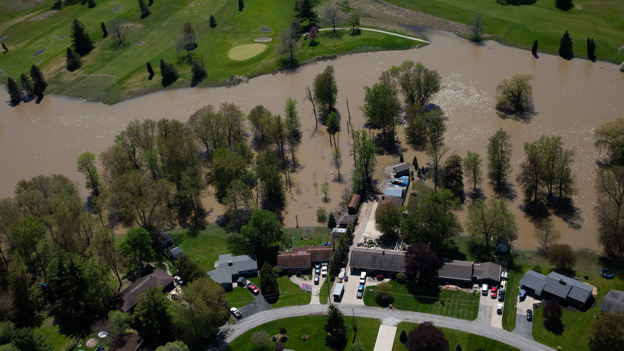 Michigan homes surrounded by flood water