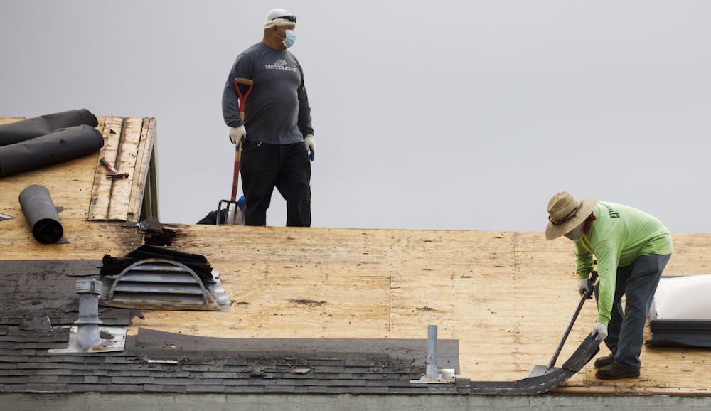 Construction workers on a roof, Redondo Beach, CA