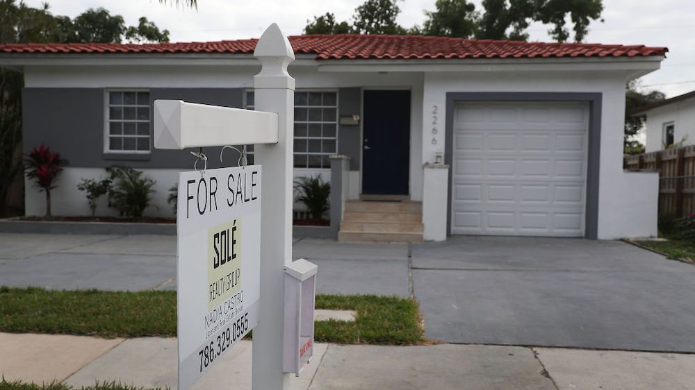 A for-sale sign is seen in front of a home in Miami, Florida.