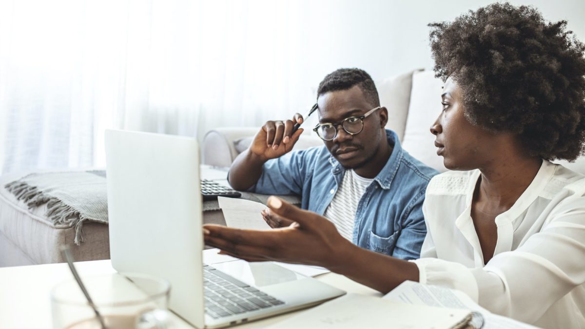 Couple looks at their financial statements