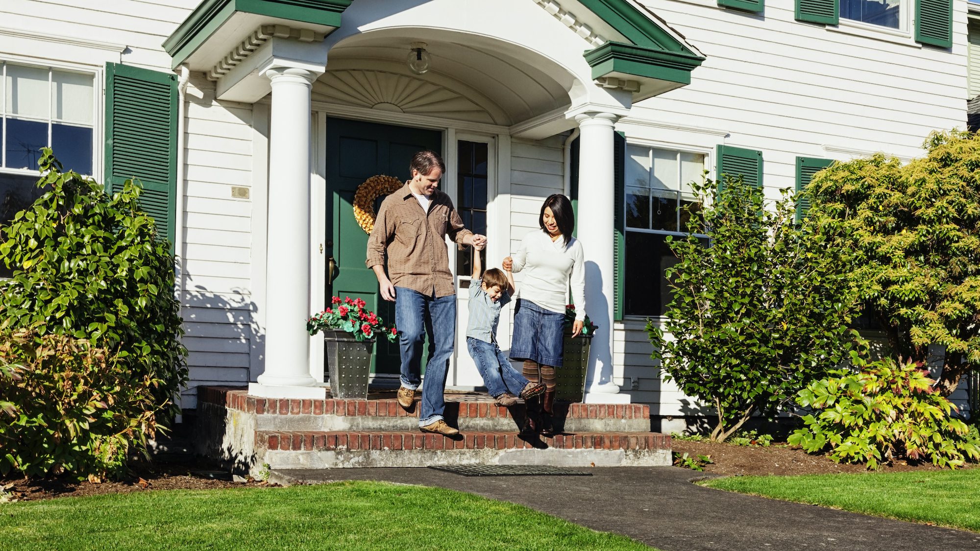 Family in front of house